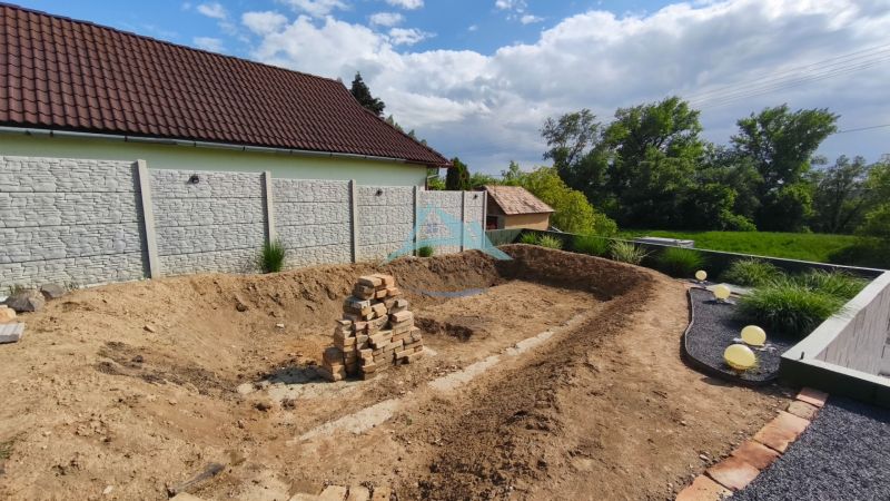 A yard with an excavation and a pile of bricks on the Recreational Grounds in Selešťany in Záhorce.