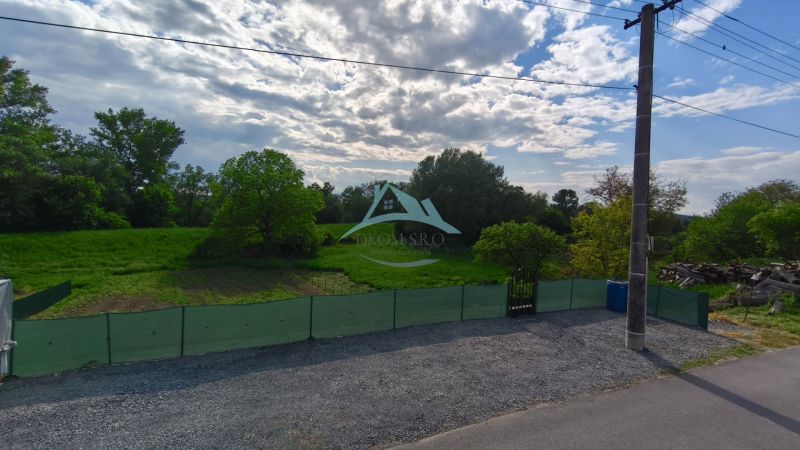 A grassy plot with fencing and trees on Recreational Lands in Záhorce, Selešťany Street.