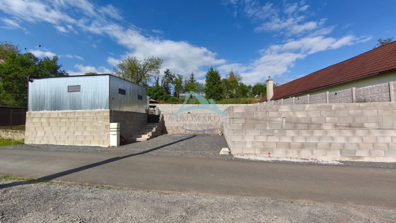 Image from Recreational Lands in Záhorce in Selešťany, shows a modern building made of bricks and metal.