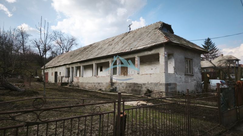 A family house on Tučekova Street in Veľký Krtíš with an old roof and a garden.