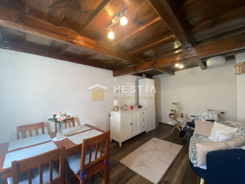 Living room in a family house with furniture and flooring in wood decor.