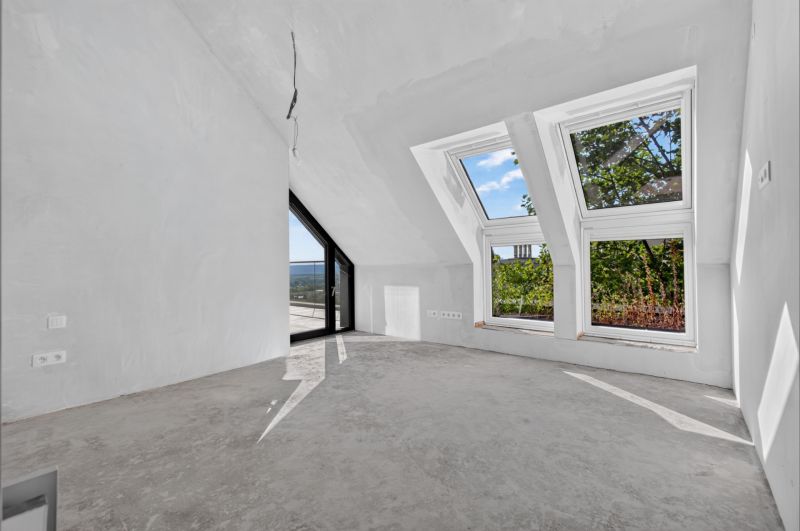 Attic room with large windows in a 5 or more room apartment, white paint.