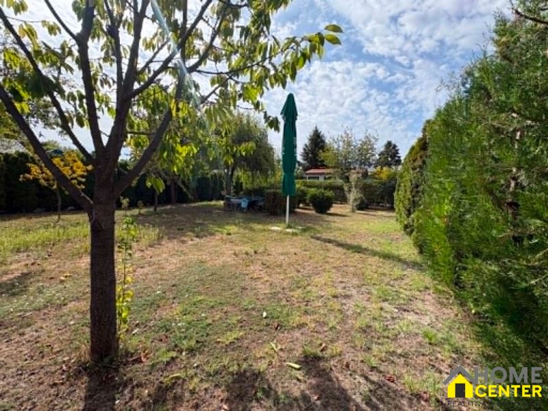 A nice garden area in Komárno with greenery and trees, ideal for relaxation.