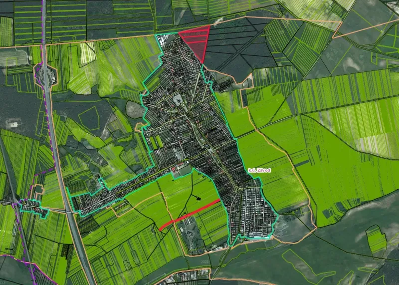 Aerial view of agricultural and forest land in Závod with paved roads.