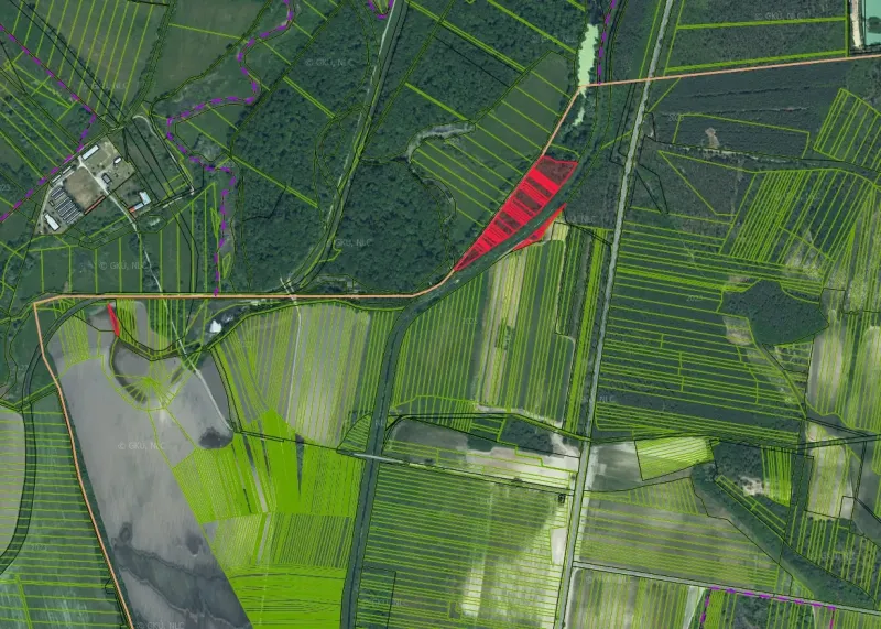 Aerial view of agricultural and forest land around Závod with marked parcels.