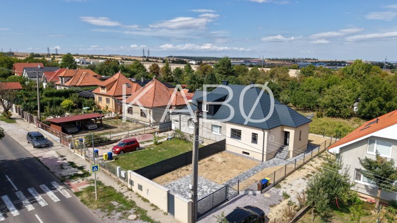 A family house on Trnavská Street in Nitra surrounded by gardens and neighboring houses.