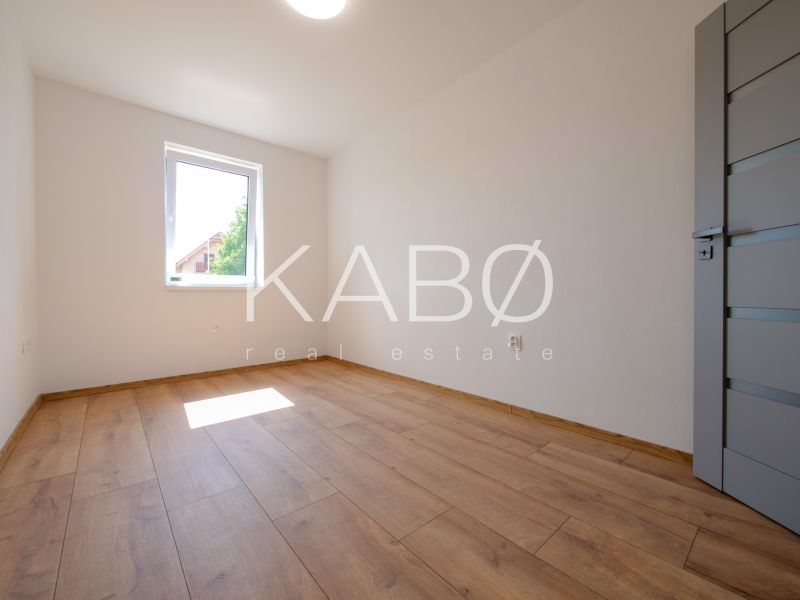 A room with a wooden floor decor in a family house without furniture.
