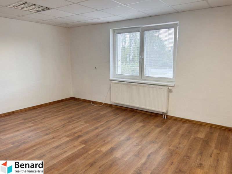 An empty room with a wooden decor floor, a window, and white walls in a family house.