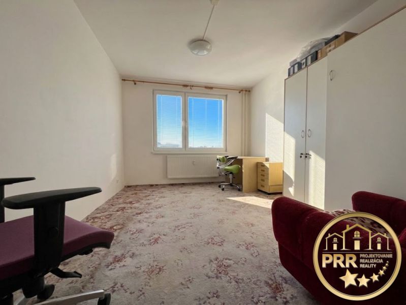A room with a carpet and furniture in a 2-room apartment, bright interior.