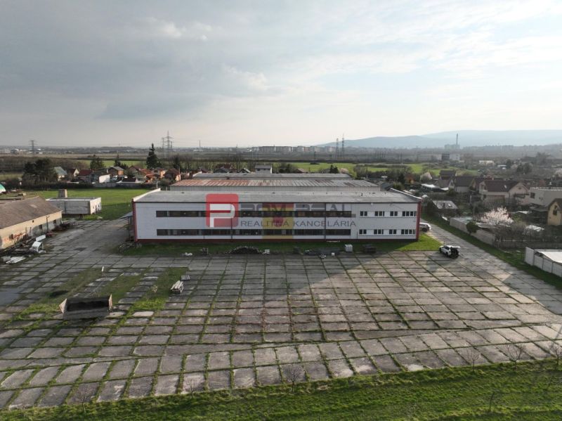 Production premises on Pezinská Street in Vinosady, large paved area.