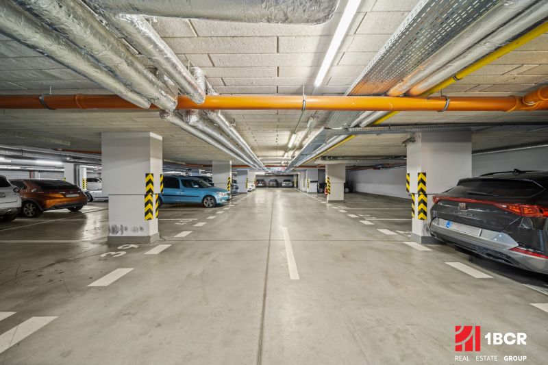 Underground parking lot with cars in Bratislava - Dúbravka on Pri Hrubej lúke street.
