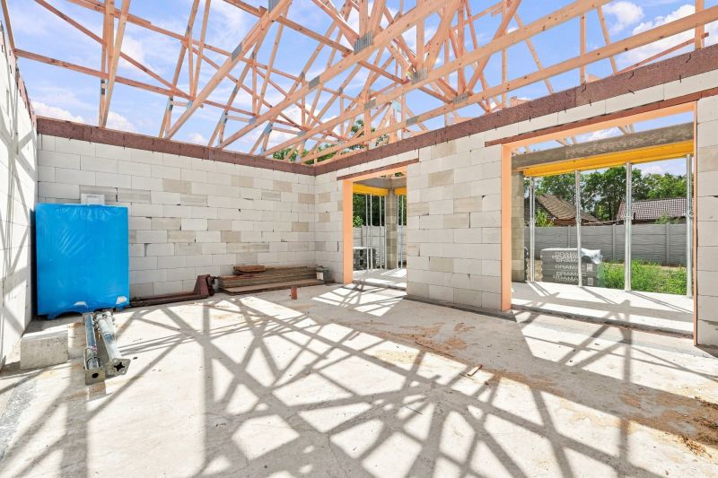 Construction of a family house in Marcelová with an unfinished roof structure.