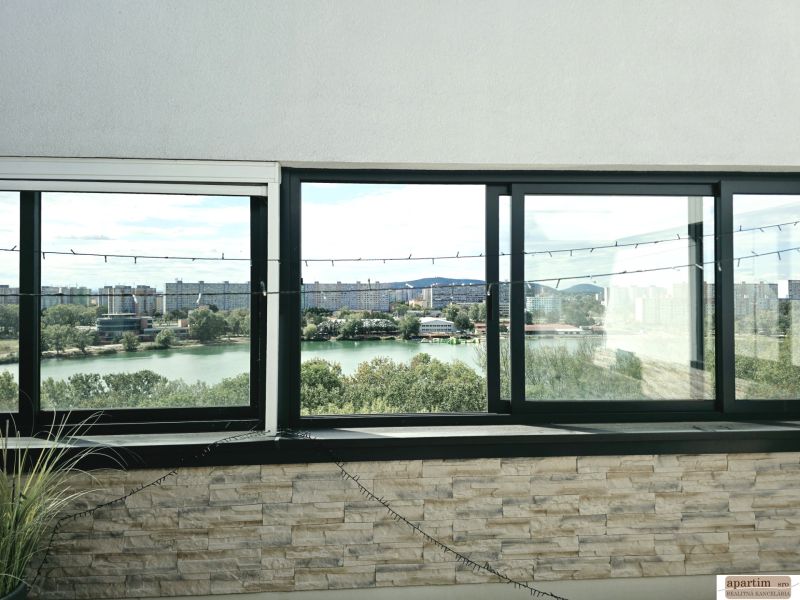 The view from Antolská to the lake in Petržalka through the large windows of a 4-room apartment.