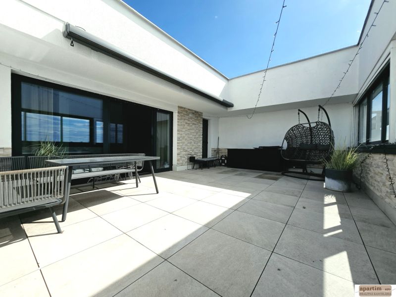 Terrace of a 4-room apartment with outdoor seating and a swing, Antolská, Bratislava - Petržalka.