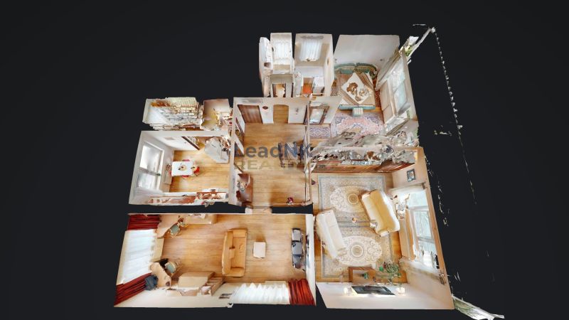 Floor plan of a 3-room apartment with furnishings and flooring with a wood decor.