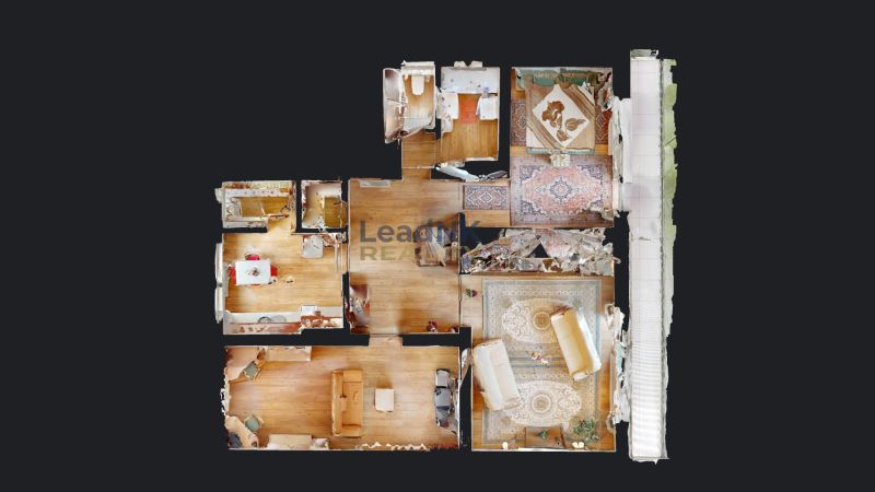 Floor plan of a 3-room apartment with wood-patterned flooring and a balcony.