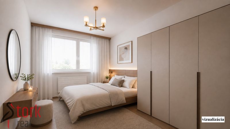 A bedroom with a bed, a wardrobe, and a wooden decor floor in a 2-room apartment.