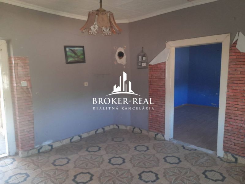 A room with a tiled floor pattern in a family house.