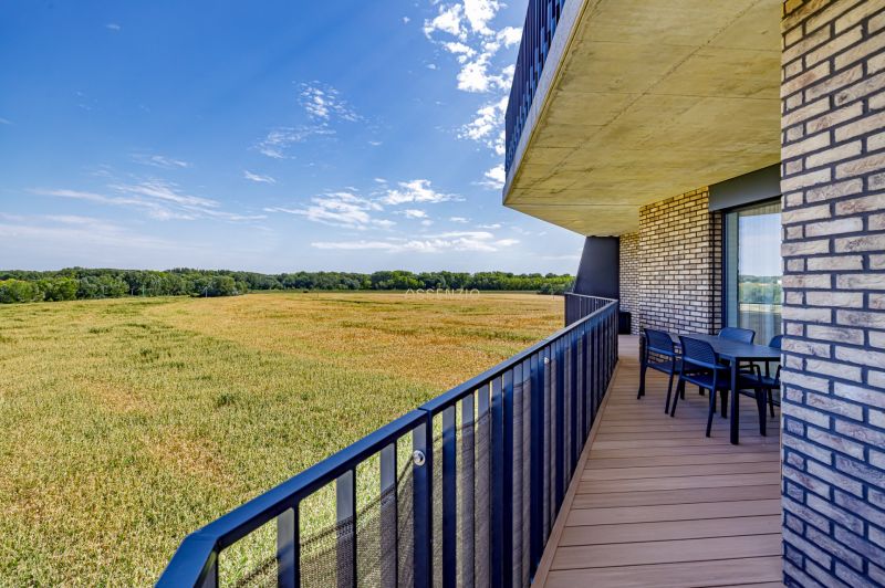 The balcony of a 3-room apartment on Fialová in Bratislava - Petržalka with a view of the field.