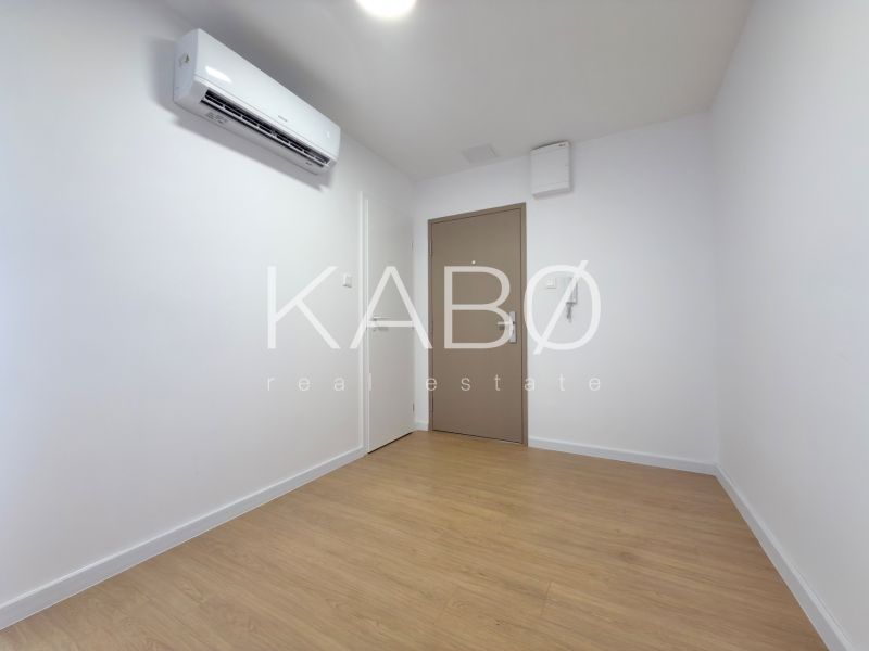 Interior of a 3-room apartment with wood-patterned flooring and air conditioning.