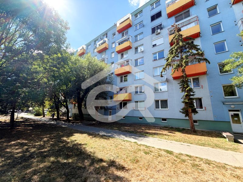 Apartment building on Lúky Street in Vráble with orange balconies.
