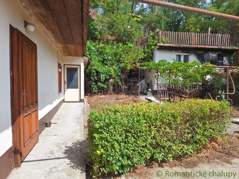 A family house in Kamenica nad Hronom with an outdoor terrace and greenery around the yard.
