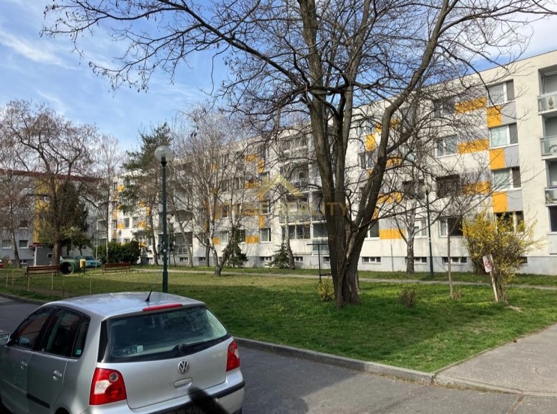 Cars parked in front of an apartment building with balconies in Bratislava - Ružinov, Staré Záhrady.