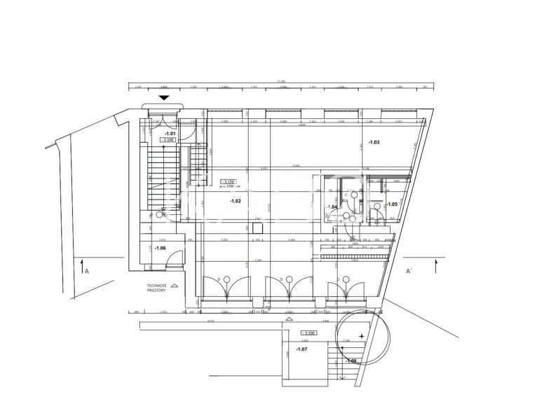 Floor plan of commercial spaces with staircase and technical rooms.