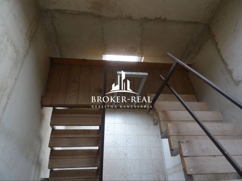 A staircase with a wooden decor in the space of Warehouses and Halls.
