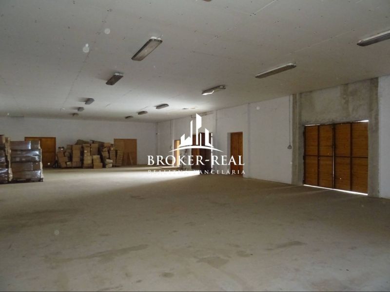 Warehouses and halls with packages and wrappers on the floor, wooden doors, lighting from the ceiling.