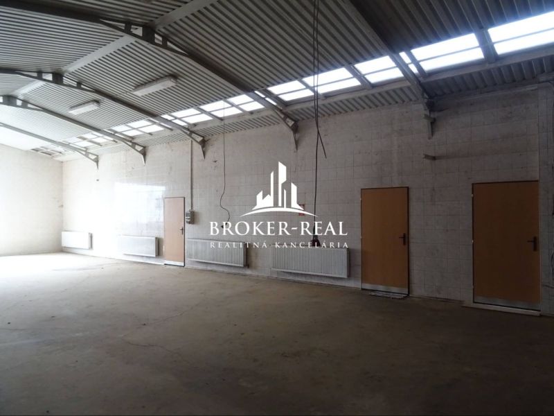 A space with high ceilings and plenty of natural light in the building Warehouses and Halls.