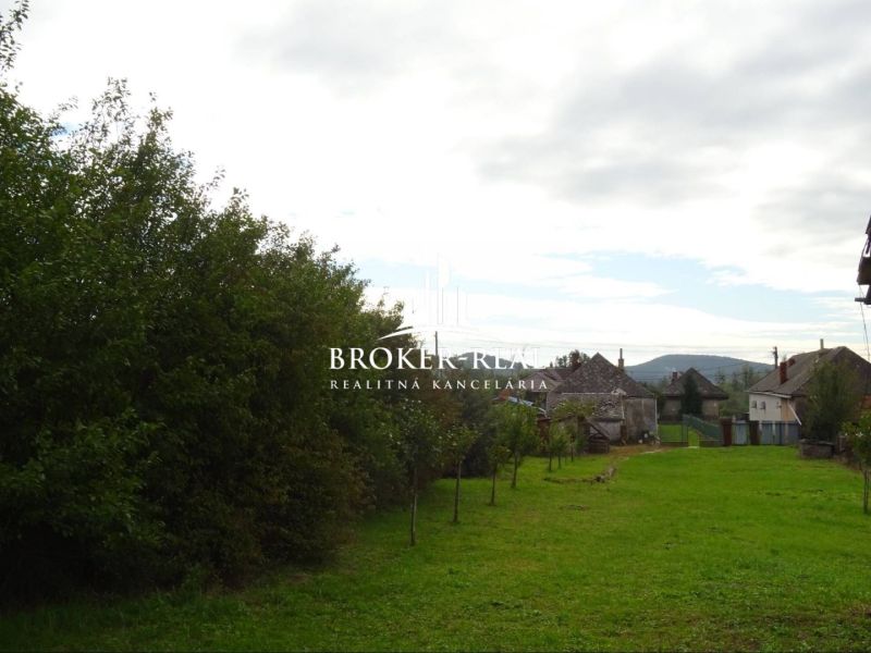 A family house in Černochov surrounded by greenery with a view of the surrounding countryside.