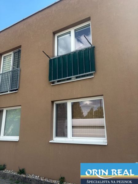 The facade of the building on Tehelná in Pezinok, Studio apartment with two windows.