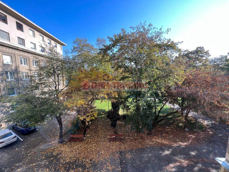 A view of the courtyard with autumn trees at the apartment building on Miletičova in Bratislava - Ružinov.