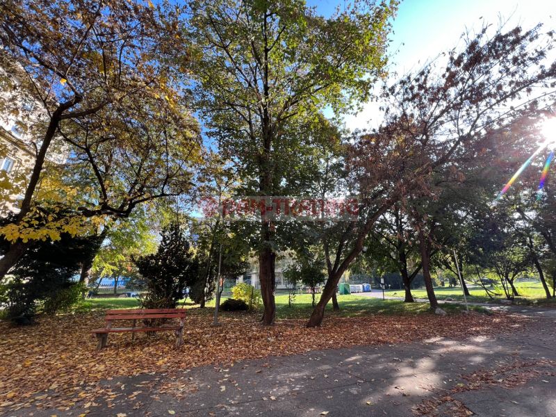 A park with a bench in autumn weather on Miletičova Street in Bratislava - Ružinov.