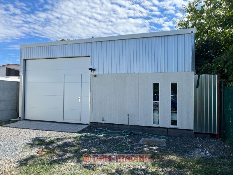Warehouse with skylights and a gate in the gardens on Galvaniho, Bratislava - Ružinov.