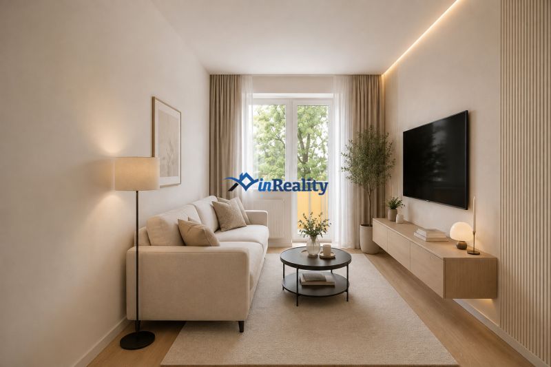 Living room in a 2-room apartment with a sofa, TV, and wooden floor decor.