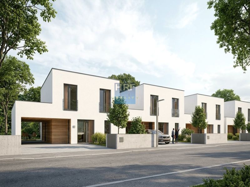Row houses in Skalica, residential plots. Modern architecture, green trees line the street.