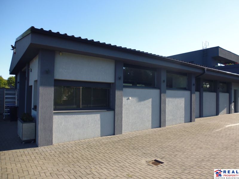 Warehouses and halls in Kračúnovce with concrete paving and modern architecture.