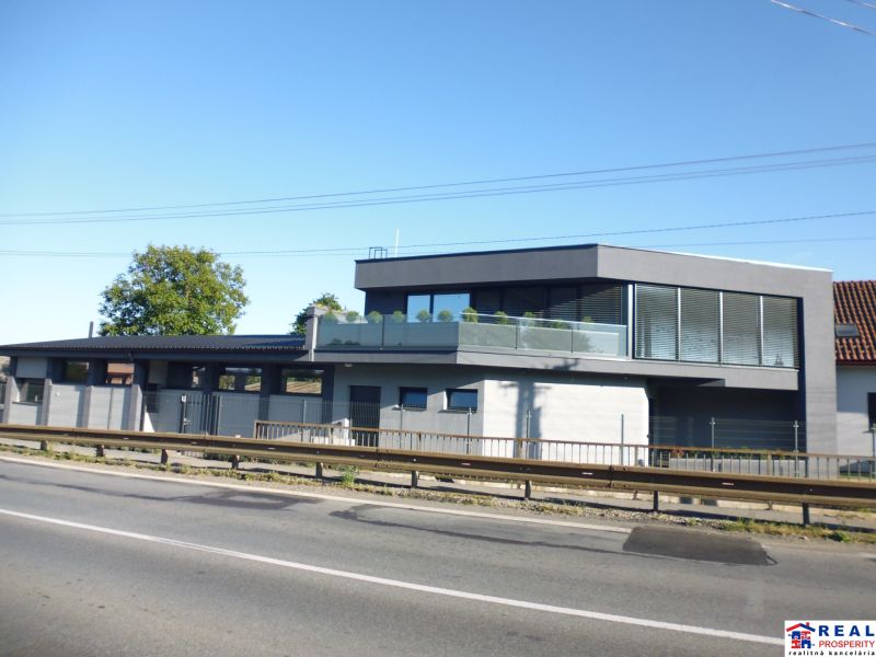 The exterior of the building in Kračúnovce with glass railings and modern design.
