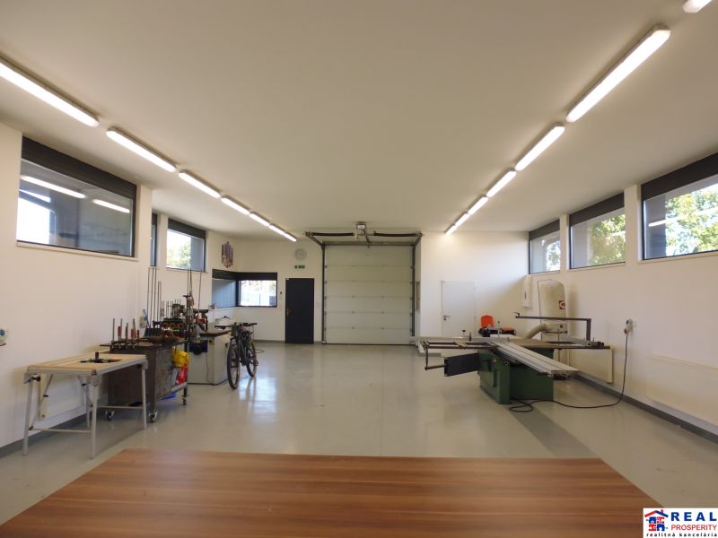 Interiors of warehouses and halls with equipment, white walls, and floors with wood decor.