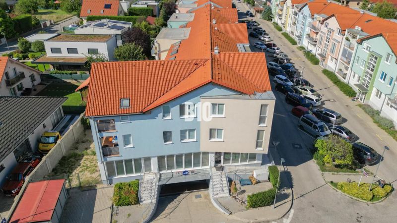 Buildings with orange roofs and a parking lot in Bratislava III.