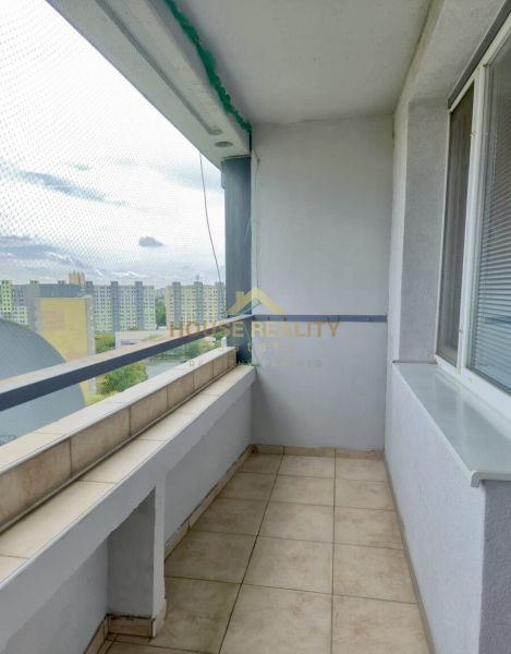 A balcony in a 3-room apartment on Gessayova Street in Bratislava - Petržalka with tiles and a railing.