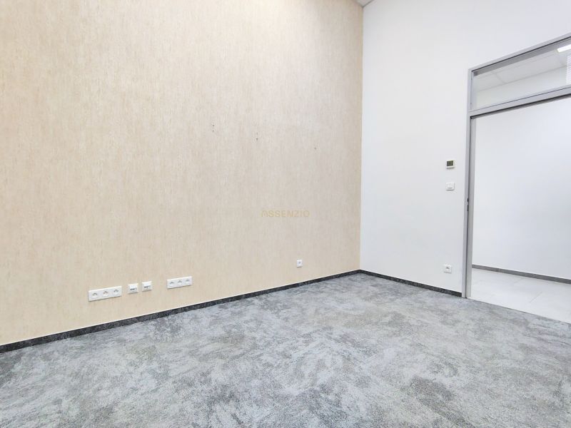 Offices with built-in drawers and carpeted floors, bright walls create a pleasant atmosphere.