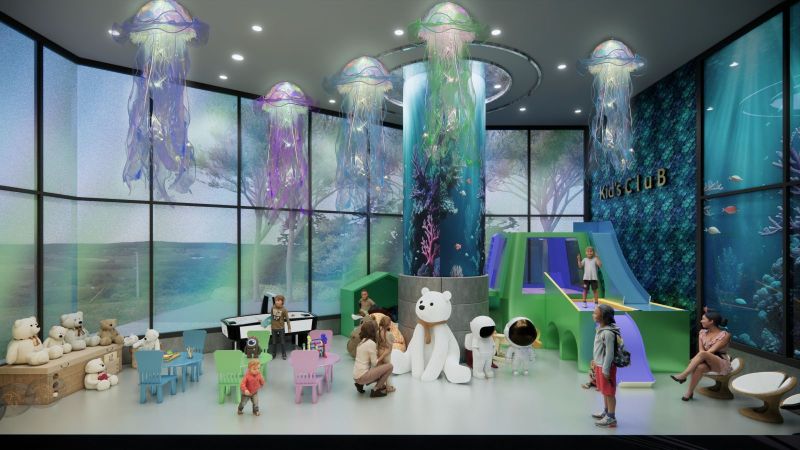 Children's club with a waterslide and bears in a recreational apartment, themed around the underwater world.