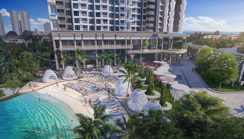 A recreational apartment in Jomtien by the pool with palm trees and sunbeds on the sand.