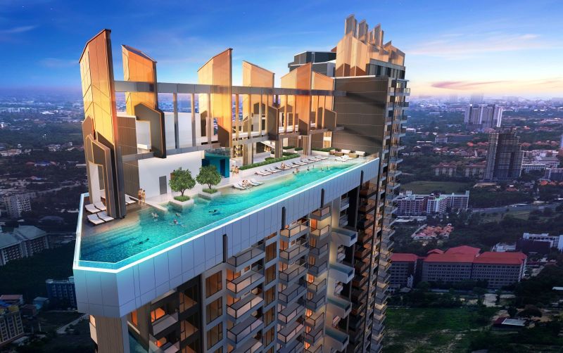 Rooftop pool of the Jomtien Holiday Apartment with panoramic city views.