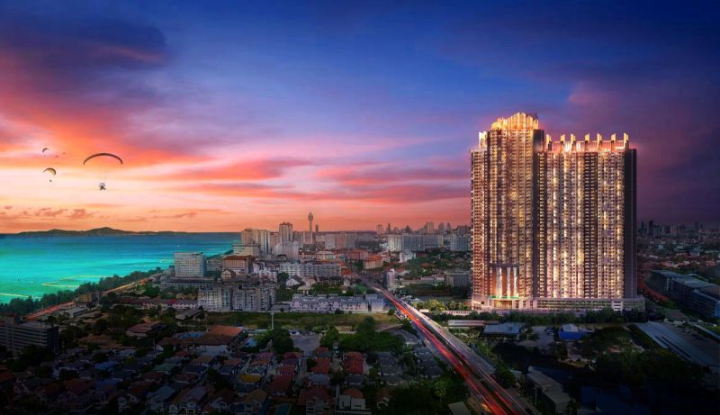 View of the recreational apartment tower in Jomtien, sunset over the sea.