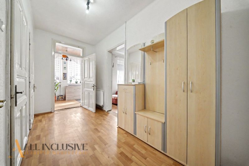 Interior of a family house with a wooden decor floor and light furniture.