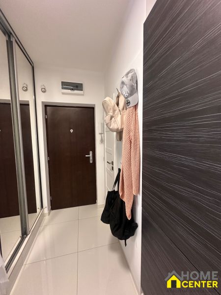 A hallway with a built-in mirrored wardrobe in a 3-room apartment.